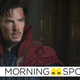Benedict Cumberbatch as a wounded Doctor Strange, standing in the Sanctum Sanctorum in his trademark red cloak.